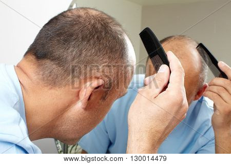 Man head with a comb.