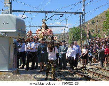 Alora Spain 24 April 2016: Religious procession crossing railway line near Alora Andalucia. Alora Spain 24 April 2016