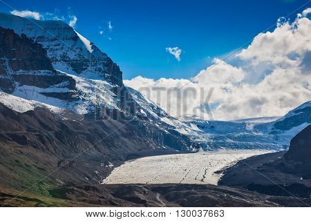 The surface of glacier is covered with huge cracks. Melting Columbia Icefield in Banff National Park, Canada