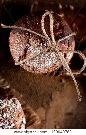 Italian maroni cookies with pieces of chocolate on old wooden background