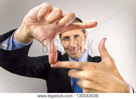 business man with hands symbol that means frame over white background
