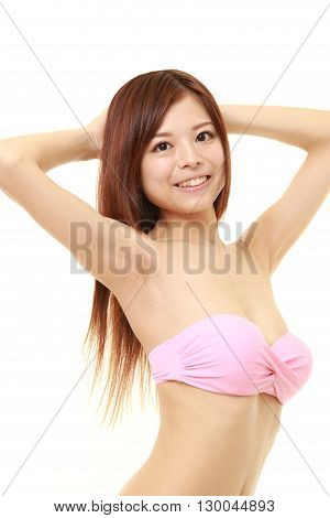 Japanese woman posing in a pink bikini