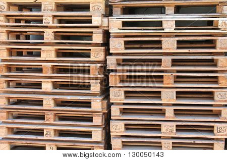 Many pallets stacked on top of each other. Construction Materials