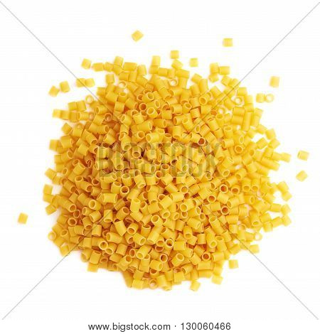 Pile of dry ditalini yellow pasta over isolated white background