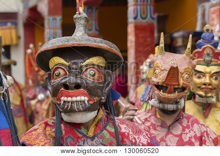 LAMAYURU INDIA - JUNE 13 2015: An unidentified buddhist lamas dressed in mystical mask dancing Tsam mystery dance in time of Yuru Kabgyat Buddhist festival at Lamayuru Gompa Ladakh North India