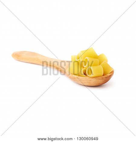 Wooden spoon filled with dry ditalini yellow pasta over isolated white background