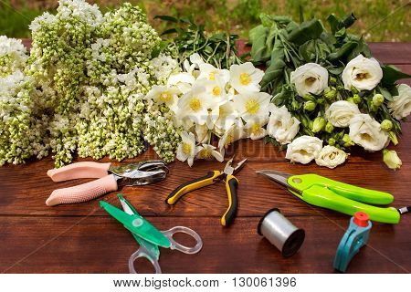 Garden Tools, Tools For Floristics And Flowers On A Wooden Table.