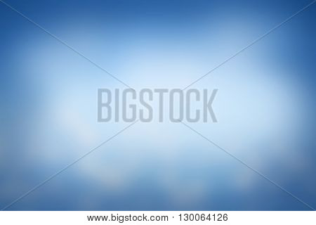 Abstract sky blue blurred background with bright sunlight - use for backdrop or design element in natural environment or health concept.