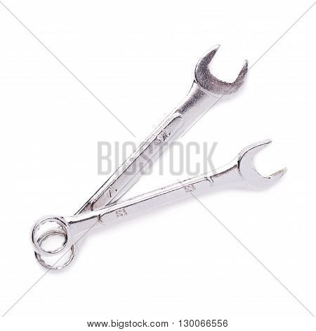 Couple of wrenchs chrome metal spanner instruments isolated over white background