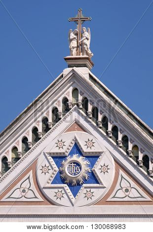 FLORENCE, ITALY - JUNE 05: IHS sign, Basilica di Santa Croce (Basilica of the Holy Cross) - famous Franciscan church in Florence, Italy, on June 05, 2015