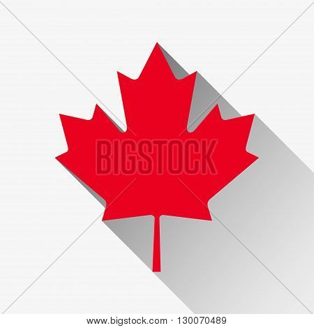 Red maple leaf with a long shadow on a white background
