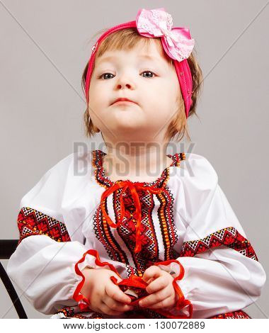 Little girl in national Ukrainian dress embroidered shirt