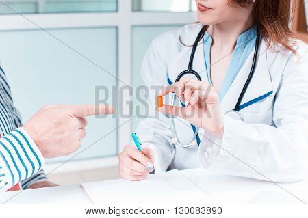 The patient and his doctor in medical office. Healthcare concept