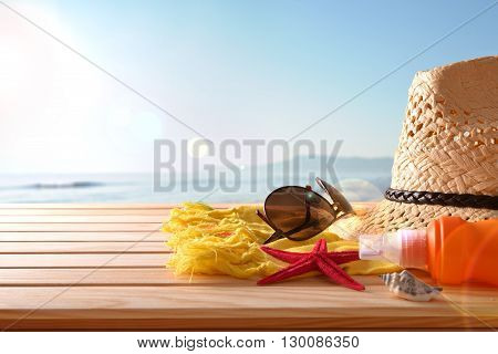 Beach Articles On A Table Wooden Slats And Sea Background