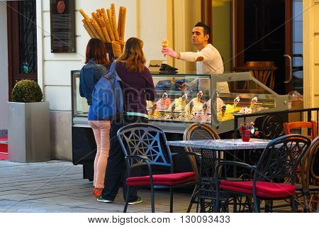 BRATISLAVA, SLOVAKIA - MAY 16, 2016: Ice cream seller in the old town of Bratislava, Slovakia on May 16, 2016.