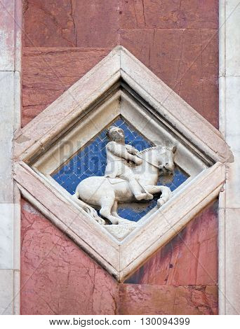 FLORENCE, ITALY - JUNE 05: Mars by Collaborator of Andrea Pisano, 1337-41., Relief on Giotto Campanile of Cattedrale di Santa Maria del Fiore, Florence, Italy on June 05, 2015