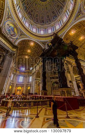 VATICAN, ITALY - JUNE 13, 2015: Dome and Baldacchino at St. Peter's Basilica in Vatican, beautiful structure and architecture.