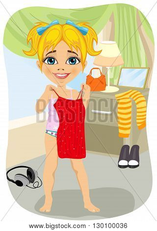 Cute little girl trying on a red dress in her bedroom
