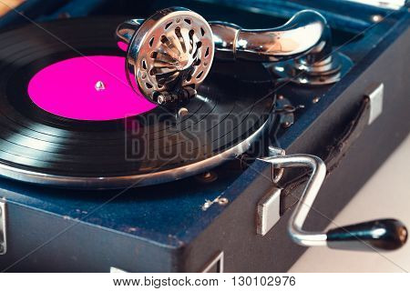 Old record player gramophone needle on record closeup. vintage toning