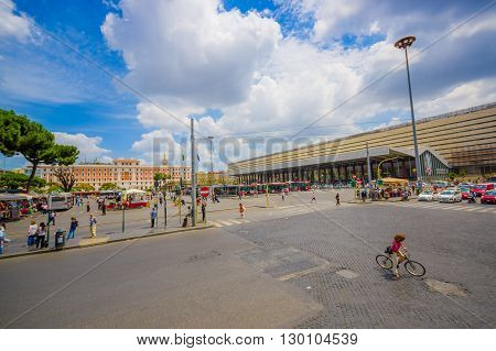 ROME, ITALY - JUNE 13, 2015: Modern bus station at Rome, people walking around and carry their lugagge, nice architecture