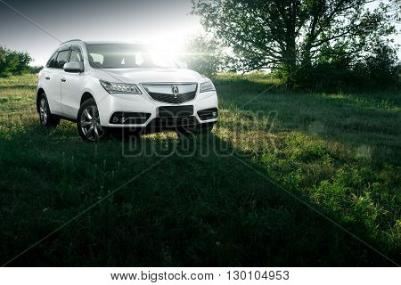 Saratov, Russia - August 11, 2015: Modern car Acura MDX standing on road at sunset