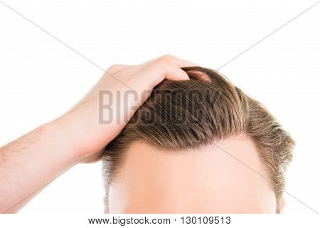 Close Up Photo Of Man Combing His Hair With Fingers
