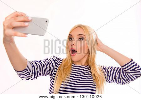 Creative Blonde Making Funny Selfie With Open Mouth