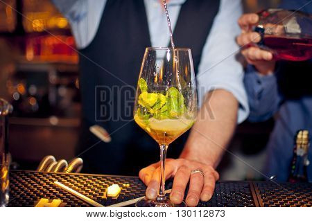 Barmen preparing coctail with mint and champaign