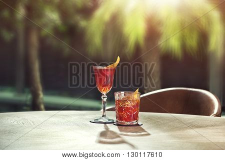 Negroni classic and Negroni sbagliato coctails, on the table