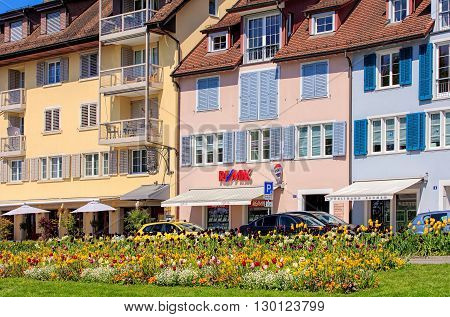 Zug, Switzerland - 6 May, 2016: buildings on Chamerstrasse street. The city of Zug is the capital of the Swiss canton of Zug.