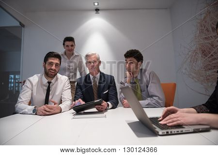 business people group brainstorming on meeting and businessman presenting ideas and projects oon laptop and tablet computer