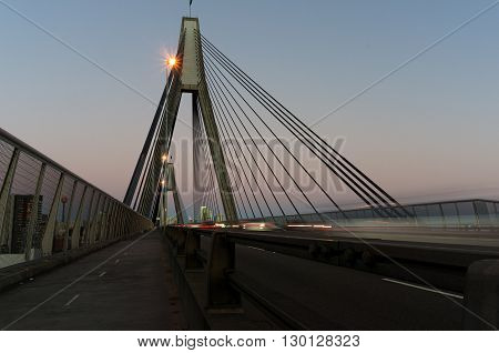 ANZAC Bridge with traffic of moving cars at dusk Sydney NSW Australia. Motion blur