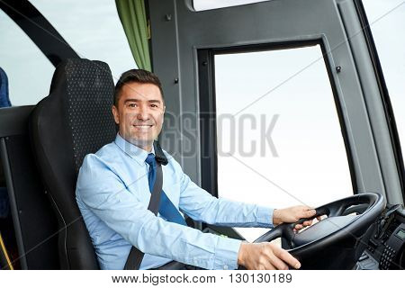 transport, tourism, road trip and people concept - happy driver driving intercity bus
