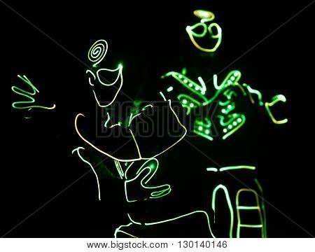 Dancers Crew In Led Suits On Dark Background, Colored Show
