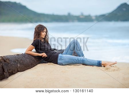 Young beautiful woman relax on the tropical beach. vacation concept