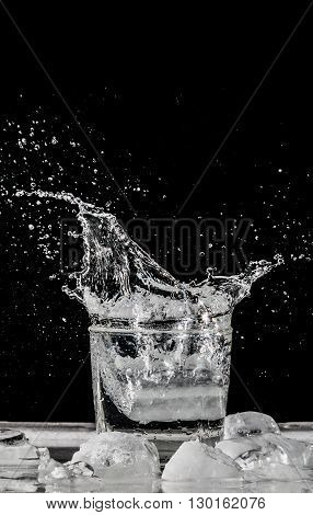 water splash in glass on black background