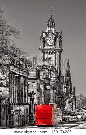 Edinburgh With Red Bus Against Clocktower In Scotland, Uk