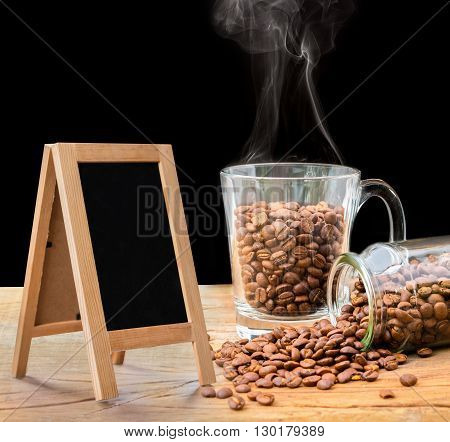 Coffee beans in glass and small blackboard