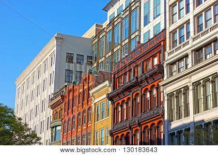 Business buildings on the street of Washington DC USA. US capital business architecture under the evening sun.
