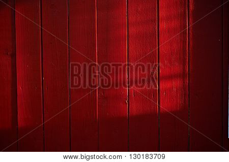 painted old wooden wall. red fence paint