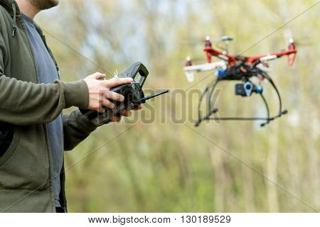 Man controling a drone.