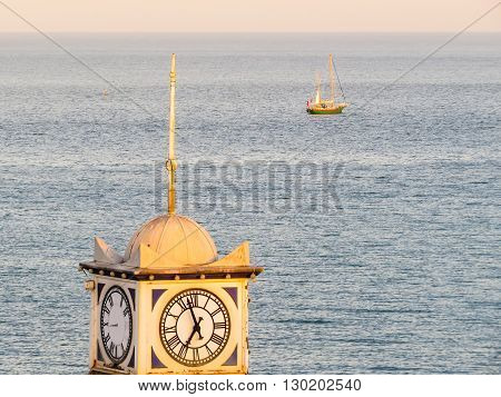 Old clock on a tower of Eastbourne's historical Victorian Pier