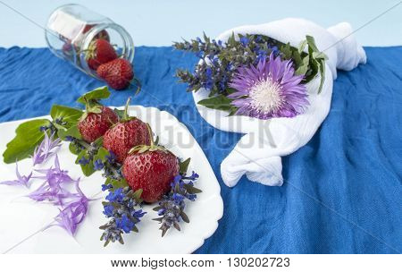 strawberries on a background of spring flowers