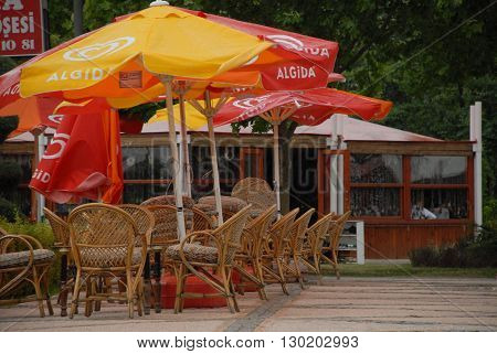 ANKARA/TURKEY-JULY 15, 2008: Umbrellas and bamboo chairs at the cafe's garden of Altinpark. July 15, 2008-Ankara/Turkey