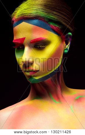 Beautiful girl with creative variegated makeup. beauty face