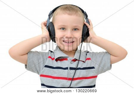 Little boy listening to headphones on a white background