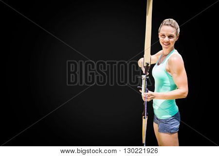 Portrait of sportswoman is practising archery