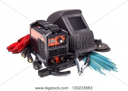 Inverter welding machine, welding equipment, isolated on a white background, welding mask, leather gloves, welding electrodes, high-voltage wires with clips, set of accessories for arc welding.