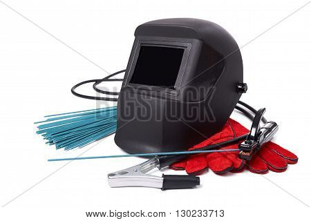 Welding equipment isolated on a white background, welding mask, leather gloves, welding electrodes, high-voltage wires with clips, set of accessories for arc welding.