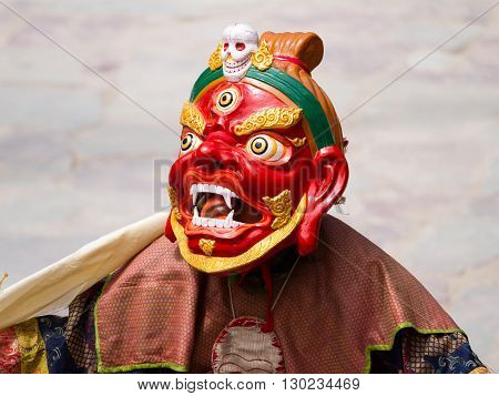 Unidentified monk performs a religious masked and costumed mystery dance of Tibetan Buddhism during the Cham Dance Festival on June 29 2012 in Hemis monastery India.